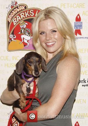 Megan Hilty holds April, a dog up for adoption Broadway Barks: The 14th Annual Dog and Cat Adopt-a-thon held in...