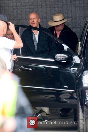 Bruce Willis gets into a car on the film set of 'A Good Day to Die Hard' Hungary, Budapest -...
