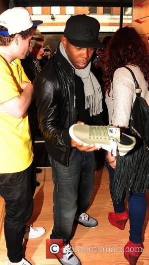 Dizzee Rascal shopping at the opening of 'Boxpark', a pop-up shopping complex created from shipping containers in London's trendy Shoreditch...