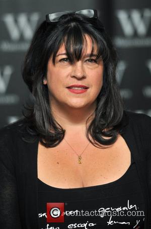 E. L. James signs copies of her...