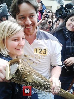James McAvoy poses with fans with the Olympic flame in Buchanan Street in Glasgow Glasgow, Scotland - 08.06.12