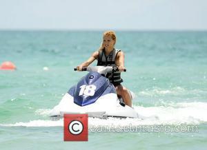 Michelle Hunziker on a water ski while on holiday at Miami beach Miami Beach, Florida - 04.06.12