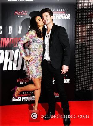 Paula Patton and Robin Thicke  New York Premiere of ''Mission: Impossible - Ghost Protocol'' at the Ziegfeld Theatre -...