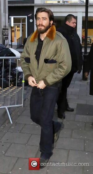A bearded Jake Gyllenhaal arrives at the BBC Radio 1 studio, wearing an army green bomber jacket  Featuring: Jake...