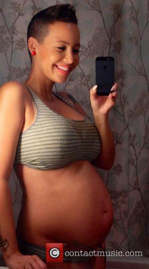 Amber Rose posted this image on Twitter with the caption: 28 weeks Rosebuds & Rosestuds! :-)