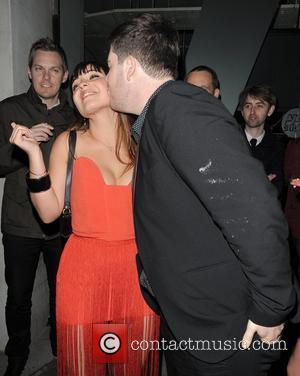 X Factor contestant Sophie Habibis kisses fellow contestant Craig Colton. The X Factor wrap party, held at DSTRKT club. London,...