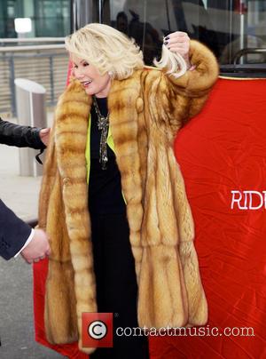 Joan Rivers - Joan Rivers gets a hair trim by her daughter Melissa as Gray Line New York inducts the...