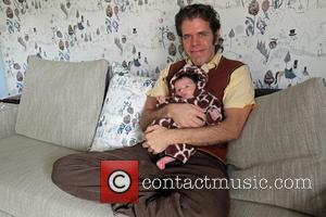 Perez Hilton Mario Armando Lavandeira III - Perez Hilton poses with his newborn son Mario Armando Lavandeira III at his...