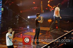 One Direction, Zayn Malik, Liam Payne and Harry Styles - One Direction performing in concert at the LG Arena -...