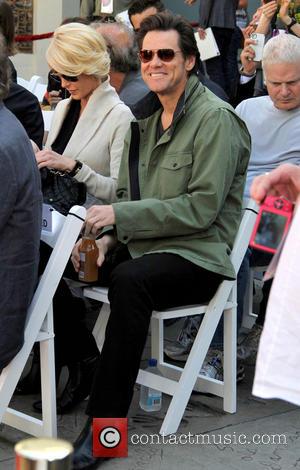 Jim Carrey - Handprint and footprint ceremony honouring actress Jane Fonda, presented as part of the '2013 TCM Classic Film...