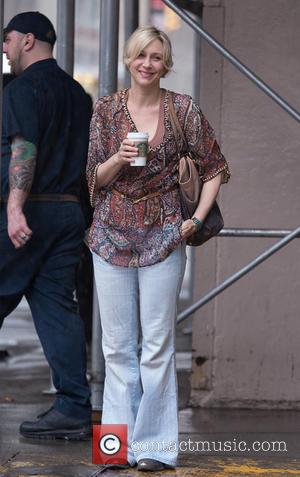 Vera Farmiga - Actress Vera Farmila waits for a cab in the rain - New York City, NY, United States...