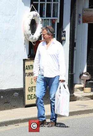 Hugh Bonneville - Hugh Bonneville and family leaving a shop