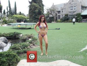 Carla Howe - Carla Howe of the Howe twins is seen around the Playboy Mansion and with Hugh Hefner and...