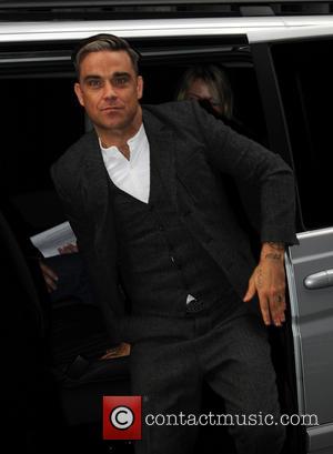 Robbie Williams - Robbie Williams arrives at Magic FM - London, United Kingdom - Wednesday 9th October 2013