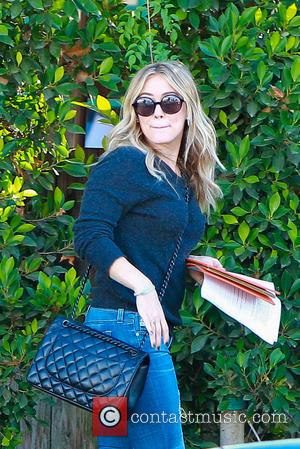 Hilary Duff - Hilary Duff dresses down wearing an old jumper, ripped jeans and Hunter wellies as she leaves Baby...