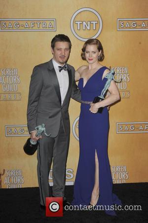 Amy Adams and Jeremy Renner - 20th Annual Screen Actors Guild Awards - Press Room - Los Angeles, California, United...