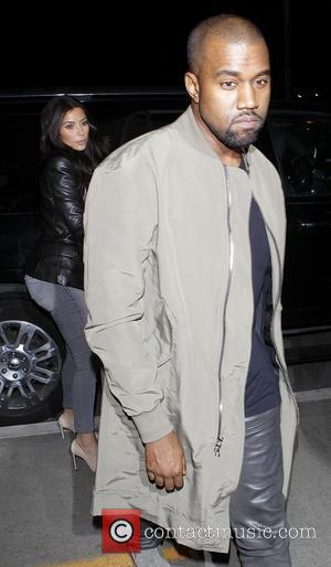 Kanye West - Kanye West and Kim Kardashian arrive at...