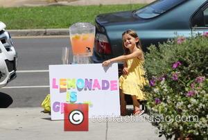 Anja Mazur - Alessandra Ambrosio watches her daughter Anja sell home made lemonade on a street in Brentwood - Los...