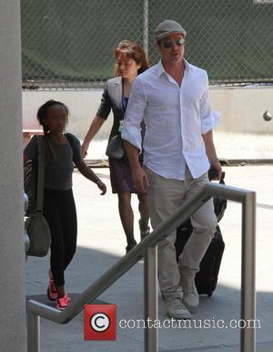 Brad Pitt - Brad Pitt and Angelina Jolie arrive at...