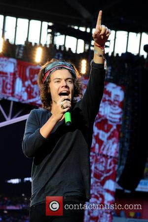 One Direction and Harry Edward Styles - One Direction performing live in concert during their 'Where We Are' tour at...