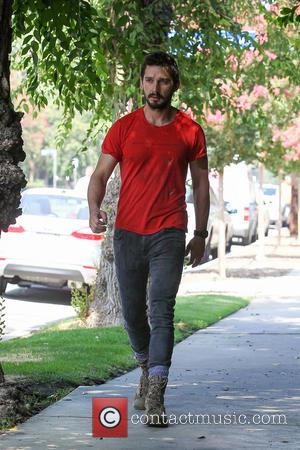Shia LaBeouf - A bearded Shia LaBeouf wearing an old red 'Mighty Alpha Superstars 1981-1982' t-shirt leaves an AA (Alcoholics...