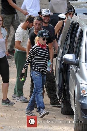 Madonna - Madonna enjoys a game of paintball with her boyfriend and children on a family holiday near Cannes in...