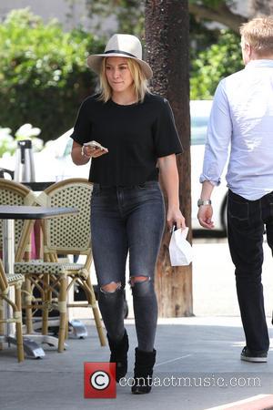 Hilary Duff - Hilary Duff leaving La Conversation Cafe in West Hollywood wearing a wide brimmed hat ripped jeans and...