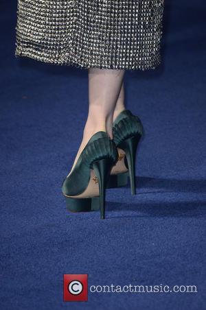 Anne Hathaway and shoes - Photographs of the Hollywood stars as they attended the UK Premiere of Sci-Fi movie 'Interstellar'...