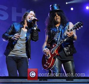 Myles Kennedy and Rock n Roll hall of famer Slash was photographed as he performed live on stage with Myles...