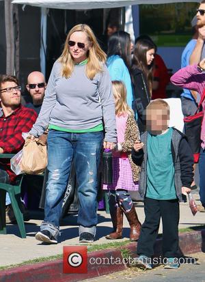 Melissa Etheridge - Melissa Etheridge and partner Linda Wallem spend the day at the Malibu Farmers Market with their children...