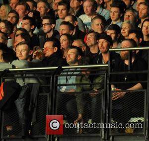 Bono and Edge - Shots of the British band Noel Gallagher's High Flying Birds as they gave a live performance...