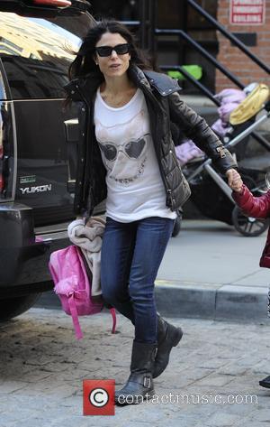 Bethenny Frankel - Bethenny Frankel picking up her daughter Bryn from school on a very windy day in New York...