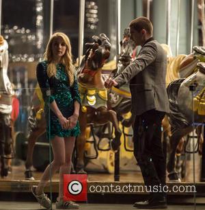 Emma Roberts and Dave Franco - Emma Roberts and Dave Franco film a scene on a carousel for their new...