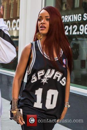 Barbadian pop star Rihanna was spotted out and about wearing a San Antonio Spurs basketball jersey while she was doing...