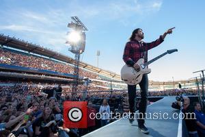 Foo Fighters' Dave Grohl Pranks Gothenburg Crowd With Broken Leg Stunt