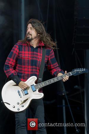 Dave Grohl Serenades Crying Fan On Stage During Colorado Concert