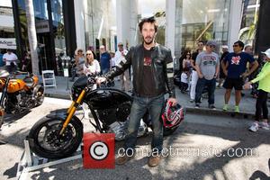 Keanu Reeves - Keanu Reeves at the Rodeo Drive Concours d'Elegance in Beverly Hills standing next to an Arch Motorcycle...