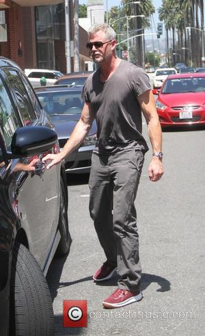 Eric Dane - Eric Dane and Rebecca Gayheart get a parking ticket while out and about in Beverly Hills running...