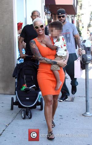 Amber Rose and Sebastian Taylor Thomaz - Amber Rose carries her son Sebastian in her arms as she goes on...