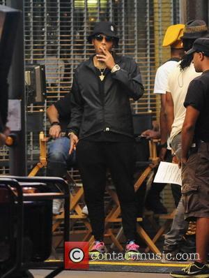 Chris Brown - Singer Chris Brown hops out of a sports car on the set of his new music video...