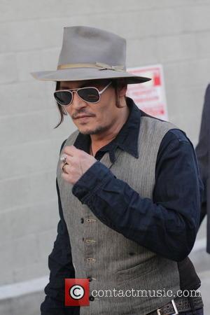 Johnny Depp - Johnny Depp comes over to greet fans as he departs his appearance on Jimmy Kimmel Live! at...