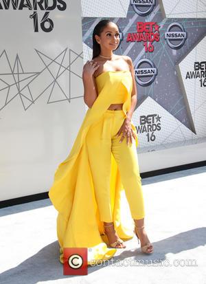 Vocalist Mya wearing a bright yellow full length dress at the 2016 BET Awards held at The Microsoft Theater L.A...