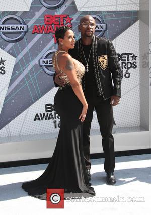 Floyd Mayweather stops for photographers alone and with Melissia Brim at the 2016 BET Awards held at The Microsoft Theater...