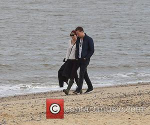 Taylor Swift and her latest beau Tom Hiddleston enjoy a romantic walk on the beach near Lowestoft in Suffolk, England....