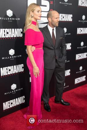 Rosie Huntington-Whiteley and her partner Jason Statham attending the premiere of Summit Entertainment's 'Mechanic 2: Resurrection' at ArcLight Hollywood in...