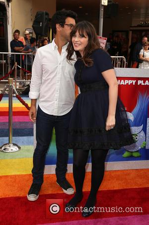 Zooey Deschanel seen alone and with Jacob Pechenik at the premiere of 20th Century Fox's 'Trolls' held at Regency Village...
