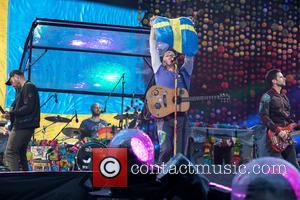 Coldplay, Guy Berryman, Jonny Buckland, Will Champion and Chris Martin at Ullevi Stadium
