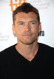 Sam Worthington & Girlfriend Lara Bingle Face $10 Million Lawsuit Following Alleged Paparazzo Assault