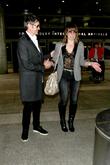 Milla Jovovich and Paul W. S. Anderson at Los Angeles International Airport