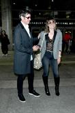 Milla Jovovich and Paul W. S. Anderson at Los Angeles International Airport